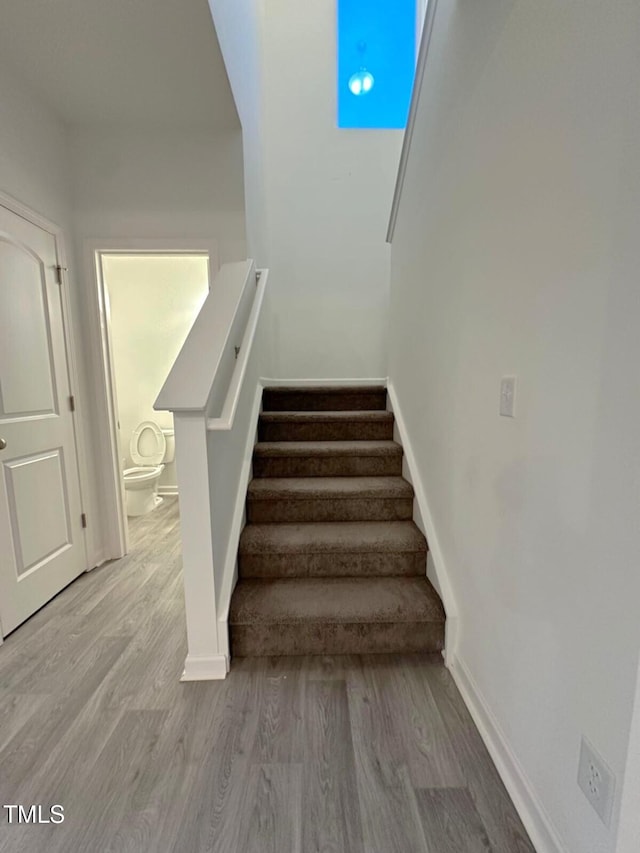 391 Curling Crk Dr, Clayton, NC 27527 - stairway with wood finished floors and baseboards
