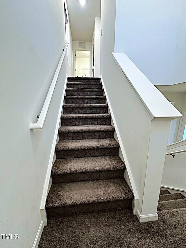 391 Curling Crk Dr, Clayton, NC 27527 - staircase with carpet flooring and baseboards