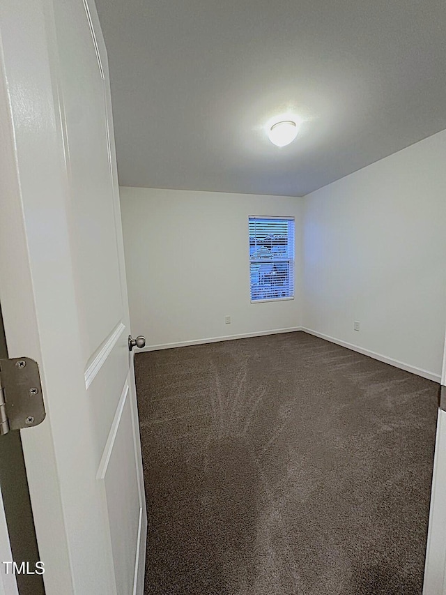 391 Curling Crk Dr, Clayton, NC 27527 - empty room with dark carpet and baseboards