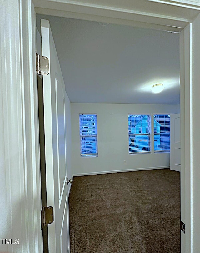 391 Curling Crk Dr, Clayton, NC 27527 - unfurnished room with dark colored carpet and baseboards
