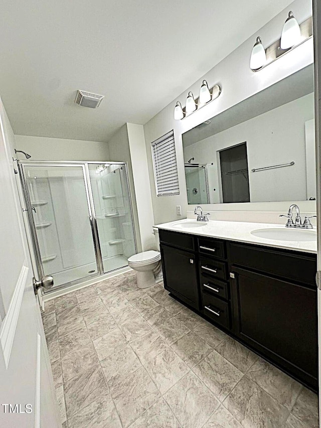 391 Curling Crk Dr, Clayton, NC 27527 - full bath featuring a shower stall, double vanity, and toilet