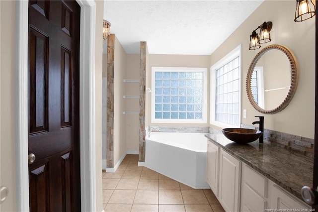 5533 Shady Pine Ct, Hope Mills, NC 28348 - full bathroom featuring vanity, a garden tub, tile patterned floors, a walk in shower, and baseboards