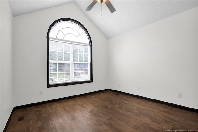 5533 Shady Pine Ct, Hope Mills, NC 28348 - spare room with ceiling fan, dark wood-style flooring, lofted ceiling, and baseboards