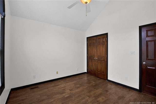 5533 Shady Pine Ct, Hope Mills, NC 28348 - unfurnished bedroom featuring dark wood-type flooring, high vaulted ceiling, baseboards, ceiling fan, and a closet