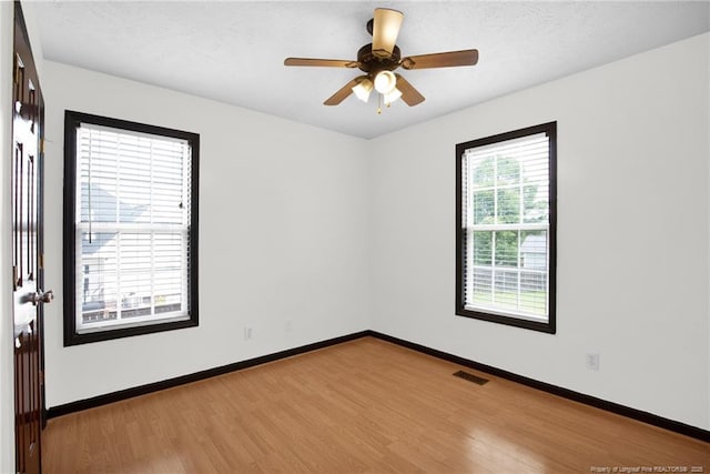 5533 Shady Pine Ct, Hope Mills, NC 28348 - unfurnished room featuring wood finished floors, baseboards, and a ceiling fan