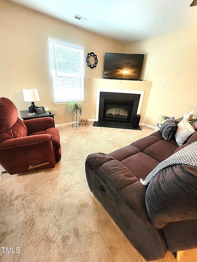 5126 Thornton Knoll Way, Raleigh, NC 27616 - carpeted living area featuring a fireplace with flush hearth and baseboards