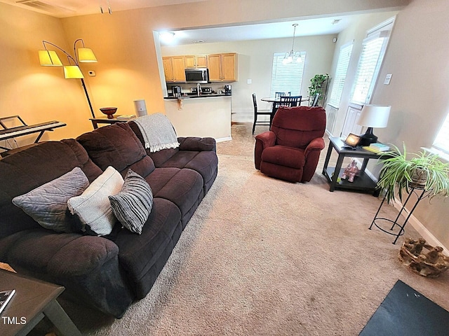 5126 Thornton Knoll Way, Raleigh, NC 27616 - living area featuring light colored carpet and plenty of natural light