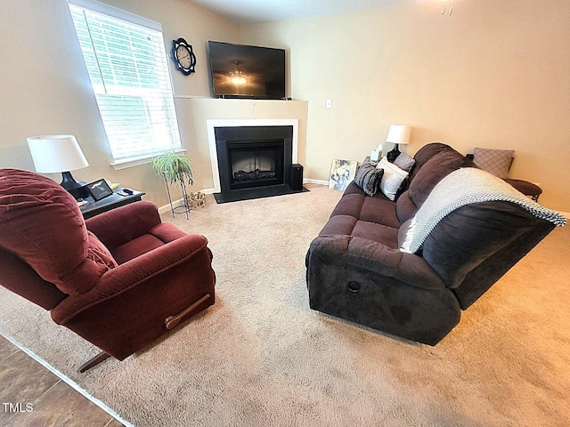 5126 Thornton Knoll Way, Raleigh, NC 27616 - carpeted living area featuring a fireplace with flush hearth and baseboards