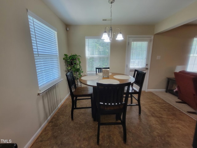 5126 Thornton Knoll Way, Raleigh, NC 27616 - dining space featuring a chandelier and baseboards