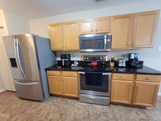 5126 Thornton Knoll Way, Raleigh, NC 27616 - kitchen with stainless steel appliances and dark stone counters