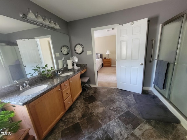5126 Thornton Knoll Way, Raleigh, NC 27616 - bathroom featuring a shower stall, double vanity, stone finish floors, and ensuite bathroom