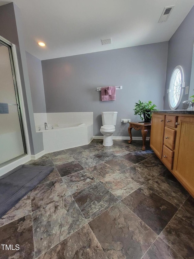 5126 Thornton Knoll Way, Raleigh, NC 27616 - bathroom with stone tile flooring, a garden tub, vanity, and a shower with shower door