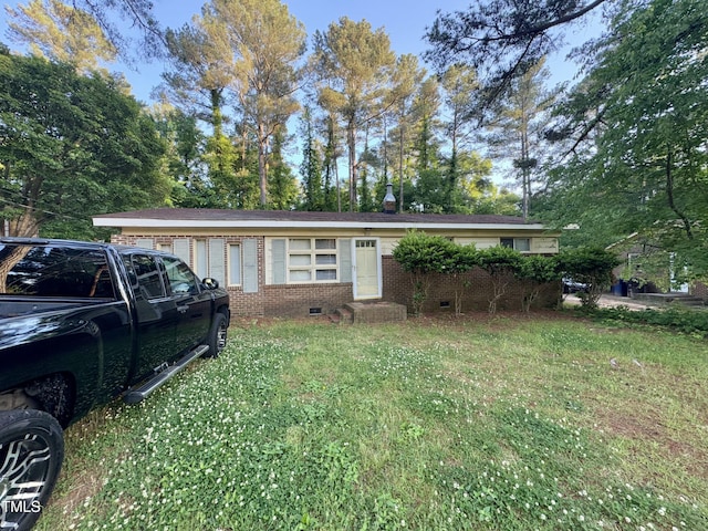 603 Pineland St, Sanford, NC 27330 - single story home featuring brick siding, entry steps, crawl space, and a front lawn