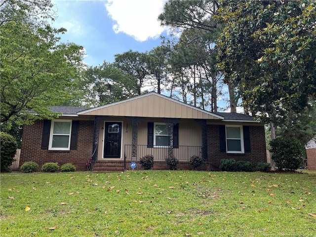 3914 Coventry Rd, Fayetteville, NC 28304 - ranch-style home featuring brick siding, a front lawn, and a porch