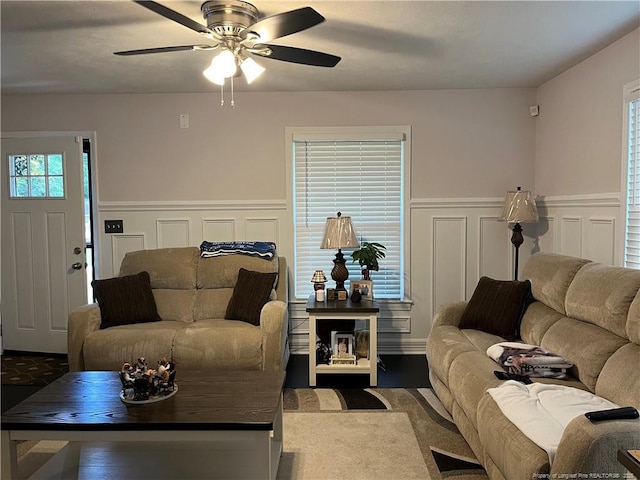 3914 Coventry Rd, Fayetteville, NC 28304 - living room featuring a wainscoted wall, ceiling fan, and a decorative wall