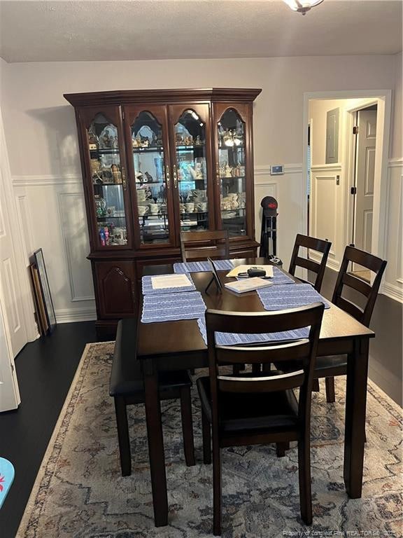 3914 Coventry Rd, Fayetteville, NC 28304 - dining space featuring a wainscoted wall and a decorative wall
