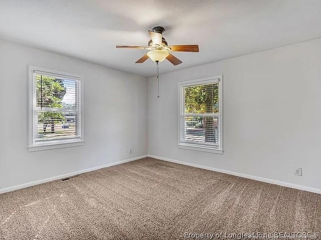 3914 Coventry Rd, Fayetteville, NC 28304 - carpeted empty room featuring healthy amount of natural light, a ceiling fan, and baseboards