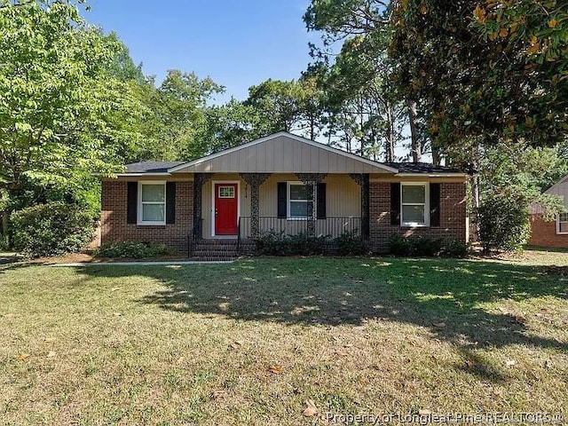 3914 Coventry Rd, Fayetteville, NC 28304 - ranch-style home with covered porch, brick siding, and a front yard