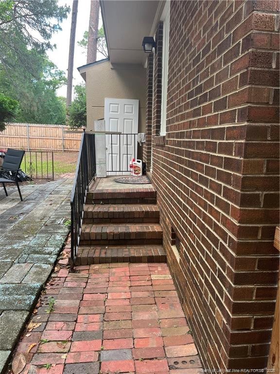 3914 Coventry Rd, Fayetteville, NC 28304 - view of exterior entry featuring brick siding