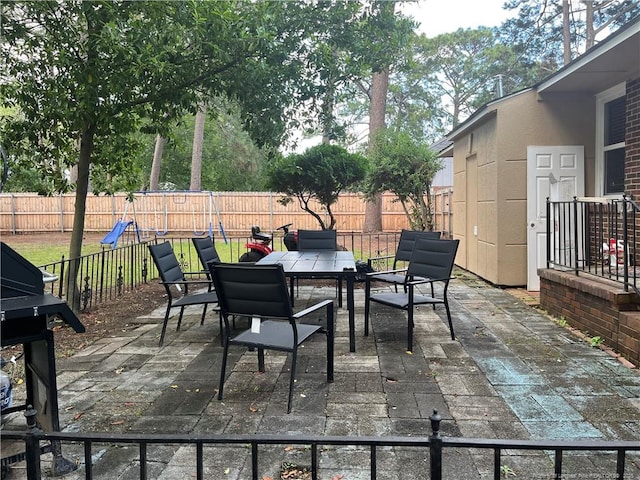 3914 Coventry Rd, Fayetteville, NC 28304 - fenced backyard with outdoor dining area and a patio