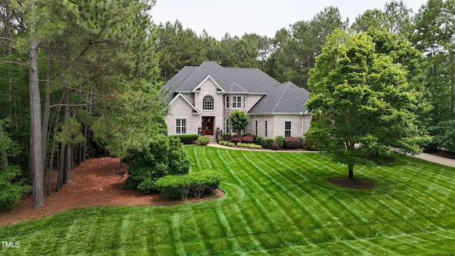 3004 Krogen Ct, Creedmoor, NC 27522 - view of front of property with a front yard and brick siding