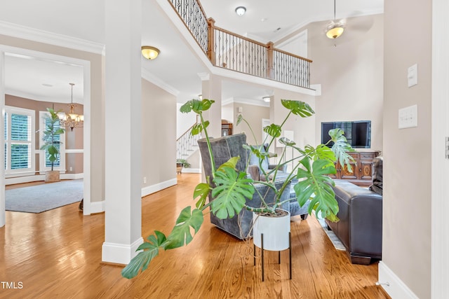 3004 Krogen Ct, Creedmoor, NC 27522 - interior space featuring wood finished floors, a chandelier, stairs, baseboards, and crown molding