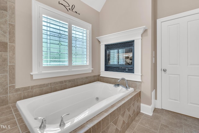3004 Krogen Ct, Creedmoor, NC 27522 - full bath featuring a tub with jets, tile patterned floors, and lofted ceiling