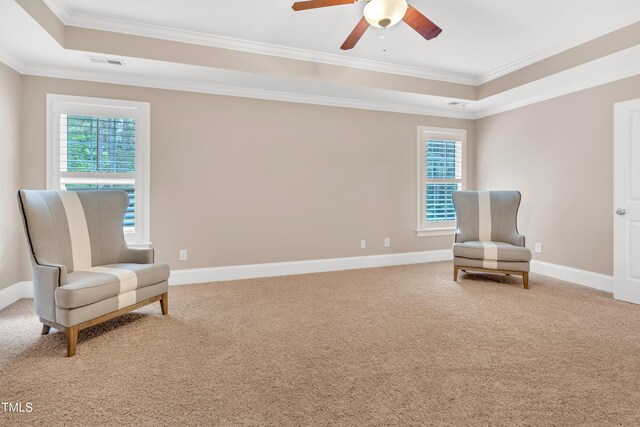 3004 Krogen Ct, Creedmoor, NC 27522 - living area featuring a raised ceiling, healthy amount of natural light, crown molding, and light colored carpet