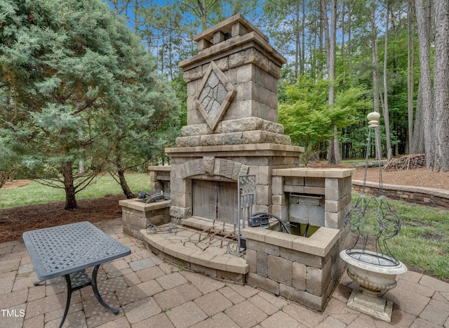 3004 Krogen Ct, Creedmoor, NC 27522 - view of patio / terrace featuring an outdoor stone fireplace