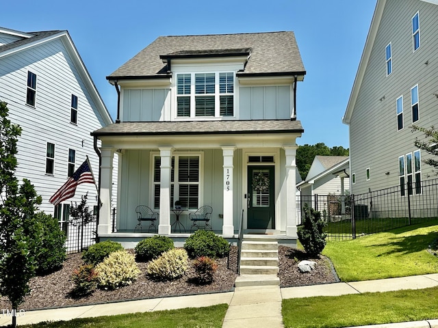 1705 Main Divide Dr, Wake Forest, NC 27587 - view of front facade with board and batten siding, covered porch, and a shingled roof