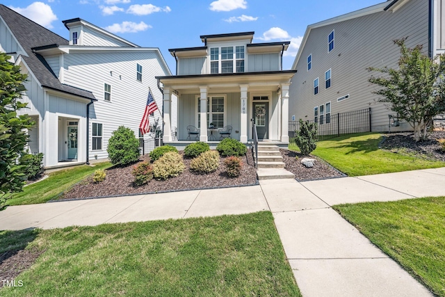 1705 Main Divide Dr, Wake Forest, NC 27587 - view of front of house featuring board and batten siding and a porch