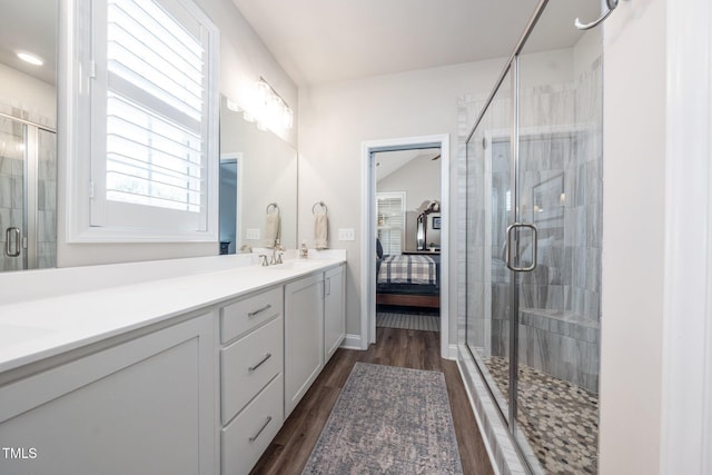 1705 Main Divide Dr, Wake Forest, NC 27587 - bathroom with double vanity, wood finished floors, ensuite bathroom, and a stall shower