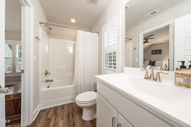 1705 Main Divide Dr, Wake Forest, NC 27587 - bathroom featuring wood finished floors, vanity, shower / bath combo, toilet, and ceiling fan