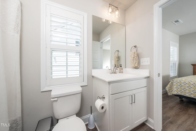 1705 Main Divide Dr, Wake Forest, NC 27587 - bathroom featuring vanity, wood finished floors, and toilet