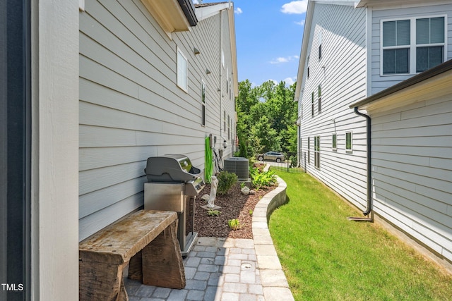 1705 Main Divide Dr, Wake Forest, NC 27587 - view of grassy yard featuring central AC