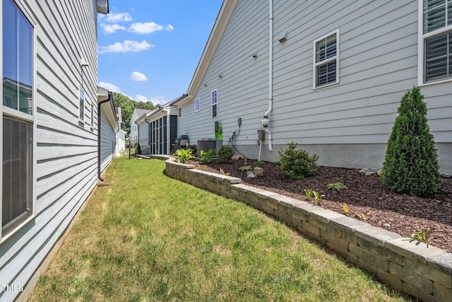 1705 Main Divide Dr, Wake Forest, NC 27587 - view of green lawn featuring central AC