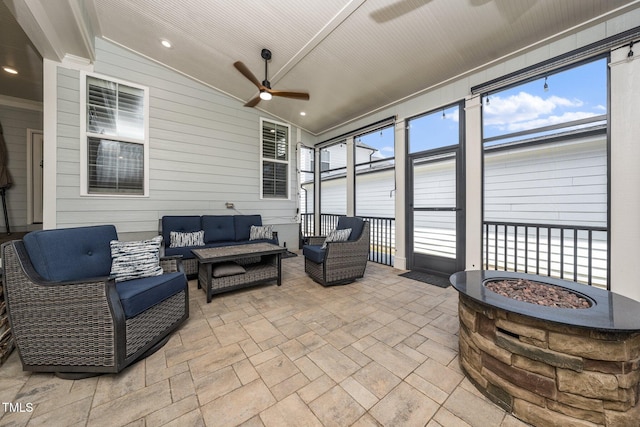 1705 Main Divide Dr, Wake Forest, NC 27587 - sunroom / solarium featuring a ceiling fan, an outdoor living space with a fire pit, and lofted ceiling