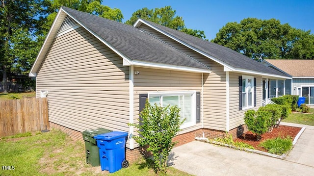 6767 Cedar Chest Ct, Fayetteville, NC 28314 - view of side of property with roof with shingles, crawl space, and a patio