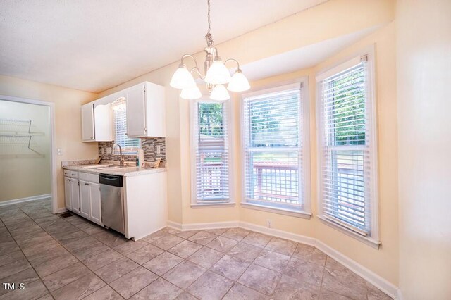 6767 Cedar Chest Ct, Fayetteville, NC 28314 - kitchen with dishwasher, a sink, a chandelier, light countertops, and white cabinets