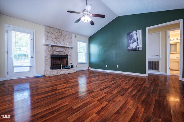 6767 Cedar Chest Ct, Fayetteville, NC 28314 - unfurnished living room with wood finished floors, lofted ceiling, a ceiling fan, a stone fireplace, and baseboards
