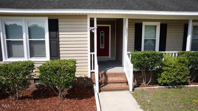 6767 Cedar Chest Ct, Fayetteville, NC 28314 - doorway to property featuring a porch and roof with shingles