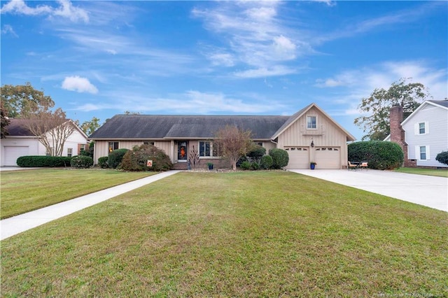 103 Kensington St, Lumberton, NC 28358 - ranch-style home featuring board and batten siding, concrete driveway, a front lawn, and a garage