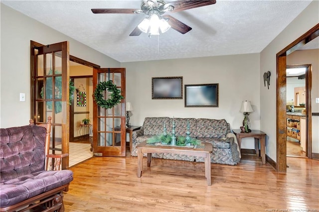 103 Kensington St, Lumberton, NC 28358 - living area with a textured ceiling, wood finished floors, a ceiling fan, and baseboards
