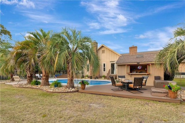 103 Kensington St, Lumberton, NC 28358 - outdoor pool with a wooden deck and a lawn