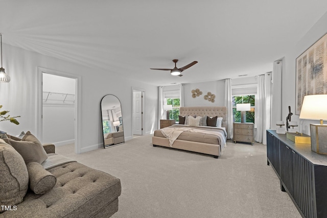 904 Pirouette Ct, Raleigh, NC 27606 - bedroom featuring light colored carpet, multiple windows, a ceiling fan, and a spacious closet