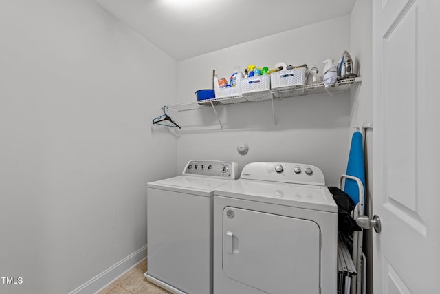 904 Pirouette Ct, Raleigh, NC 27606 - washroom featuring washer and clothes dryer, baseboards, and light tile patterned floors