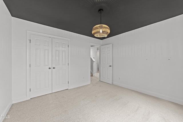 904 Pirouette Ct, Raleigh, NC 27606 - unfurnished bedroom featuring carpet flooring, baseboards, and a closet