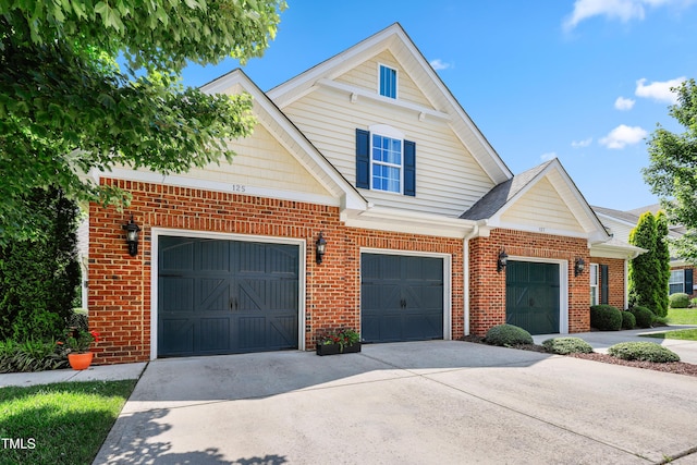 127 Bobwhite Way, Mebane, NC 27302 - view of front of property featuring brick siding, concrete driveway, and an attached garage