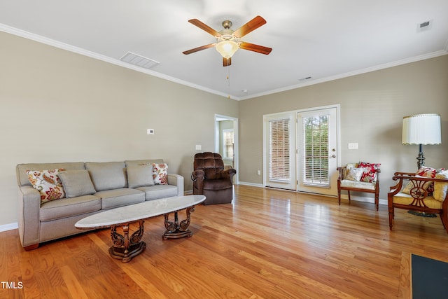 127 Bobwhite Way, Mebane, NC 27302 - living room featuring a ceiling fan, baseboards, light wood-style flooring, and crown molding