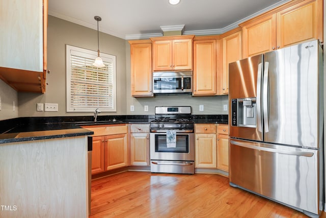 127 Bobwhite Way, Mebane, NC 27302 - kitchen with stainless steel appliances, ornamental molding, a sink, light wood-style flooring, and light brown cabinets